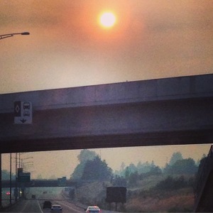 Smoke over the highway. Weird red sun.